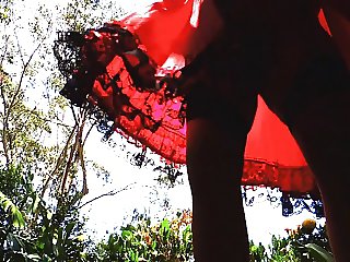 sissy ray outdoors in red dress 2