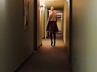 Sissy Ray in Hotel Corridor in Purple Maids Uniform
