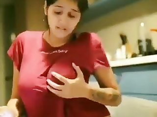 Aroused desi girl touching and squeezing boobs