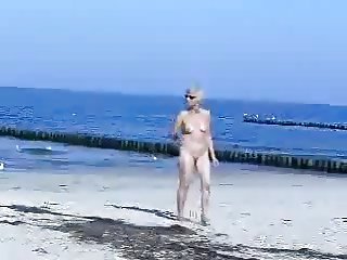 Cute hot granny fully naked at beach. Public nudity